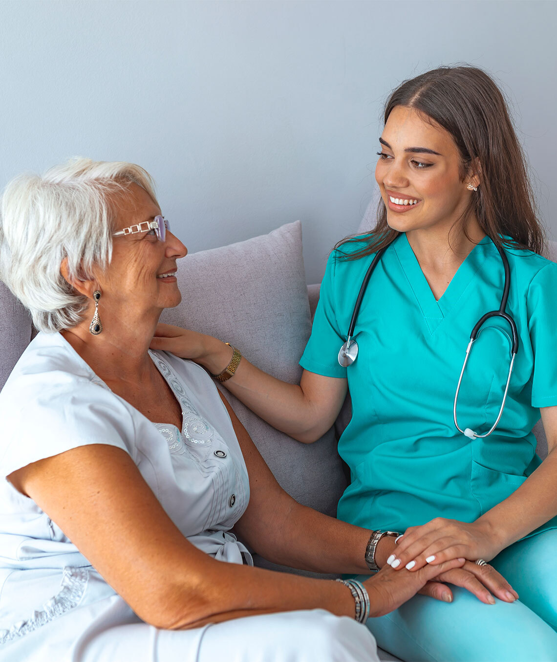 Young female nurse with elderly female