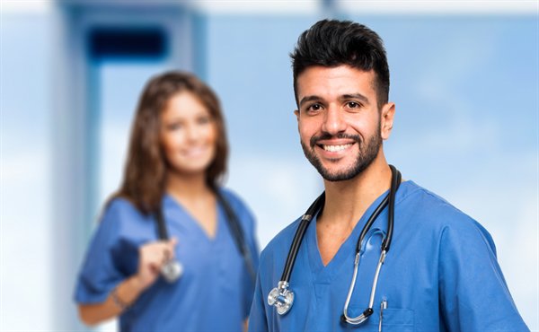 Healthcare professionals in blue scrubs